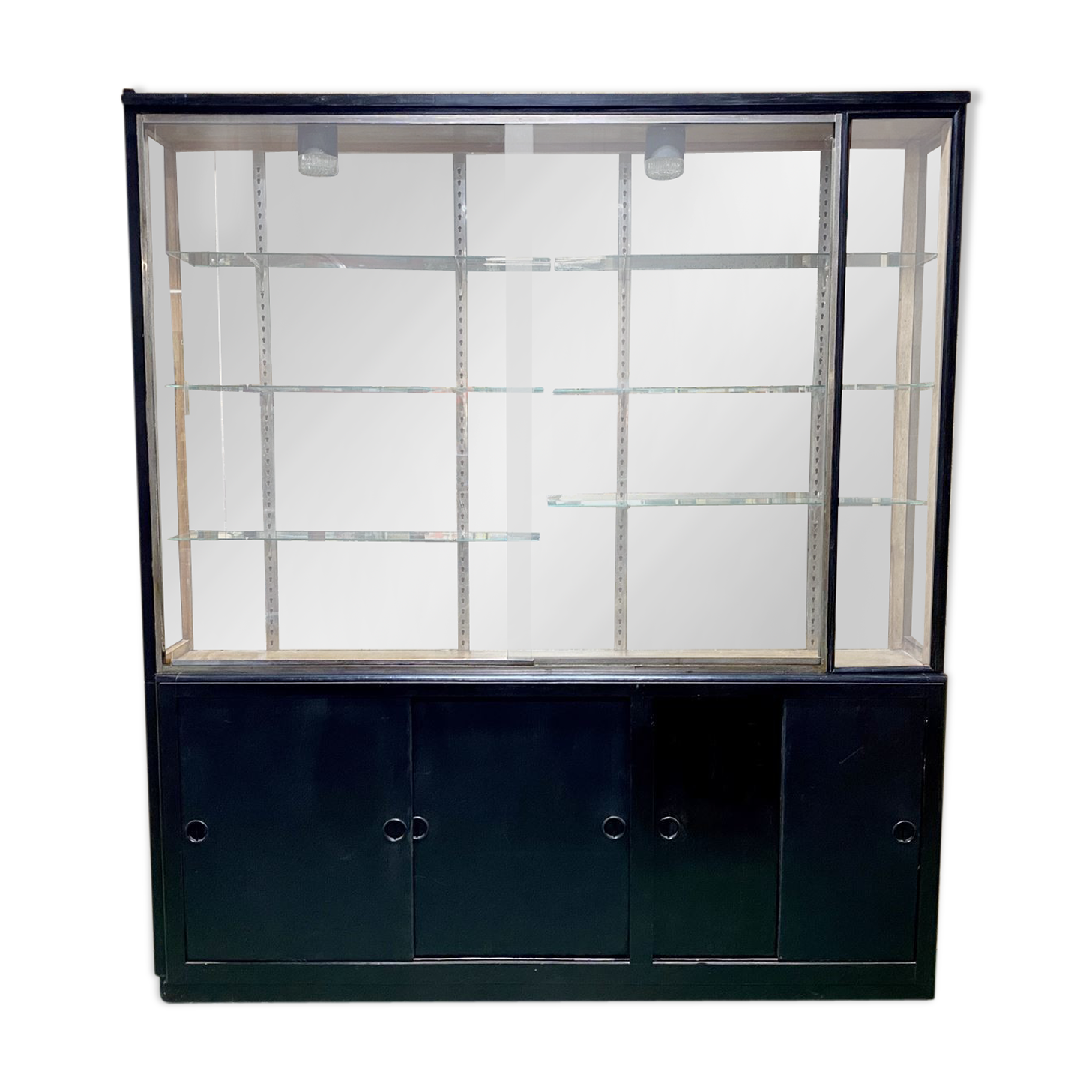Store window with sliding doors in matte black patinated oak - 30s