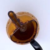 Yellow and brown ceramic pitcher