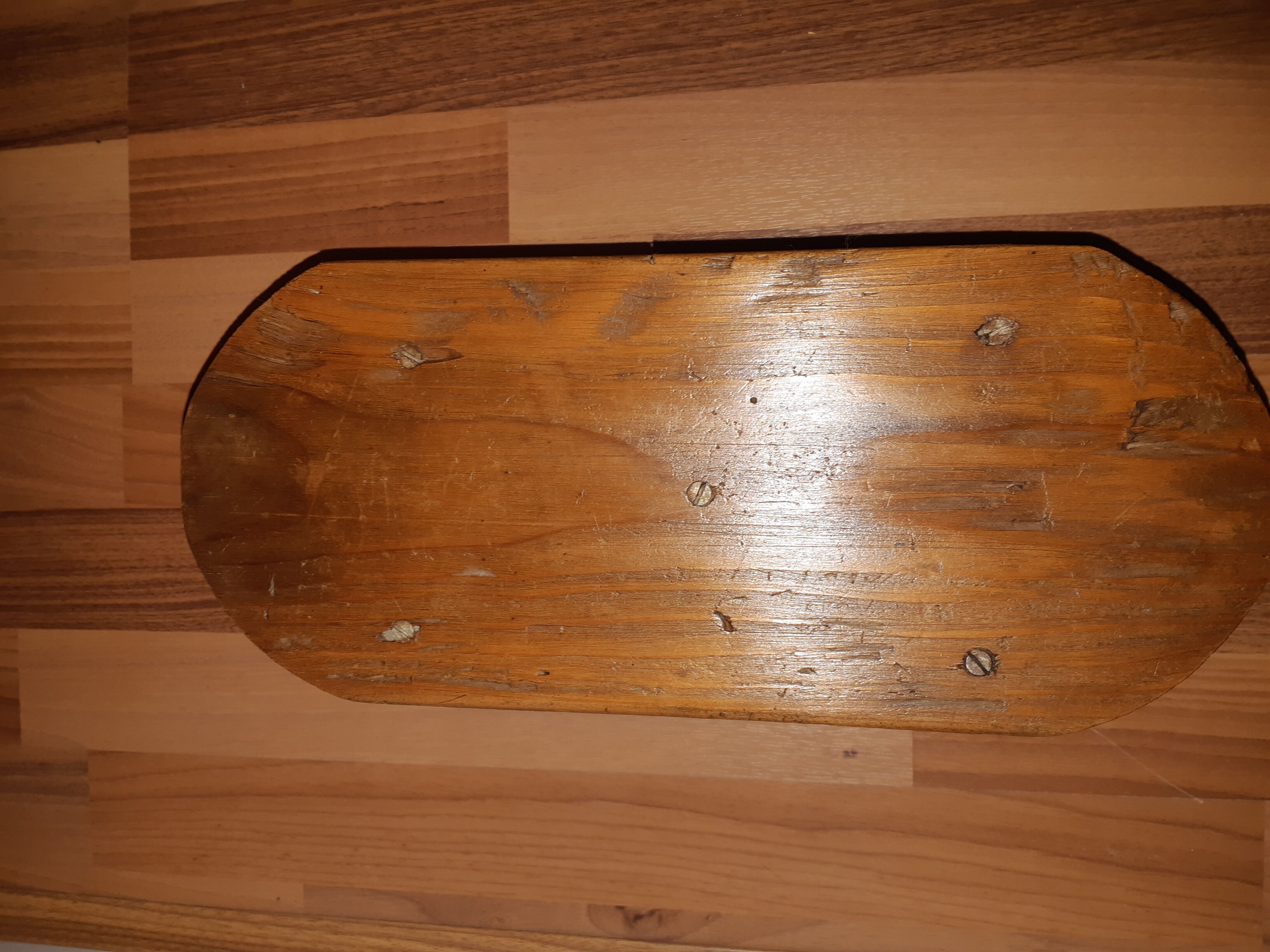 Low milking stool in waxed wood