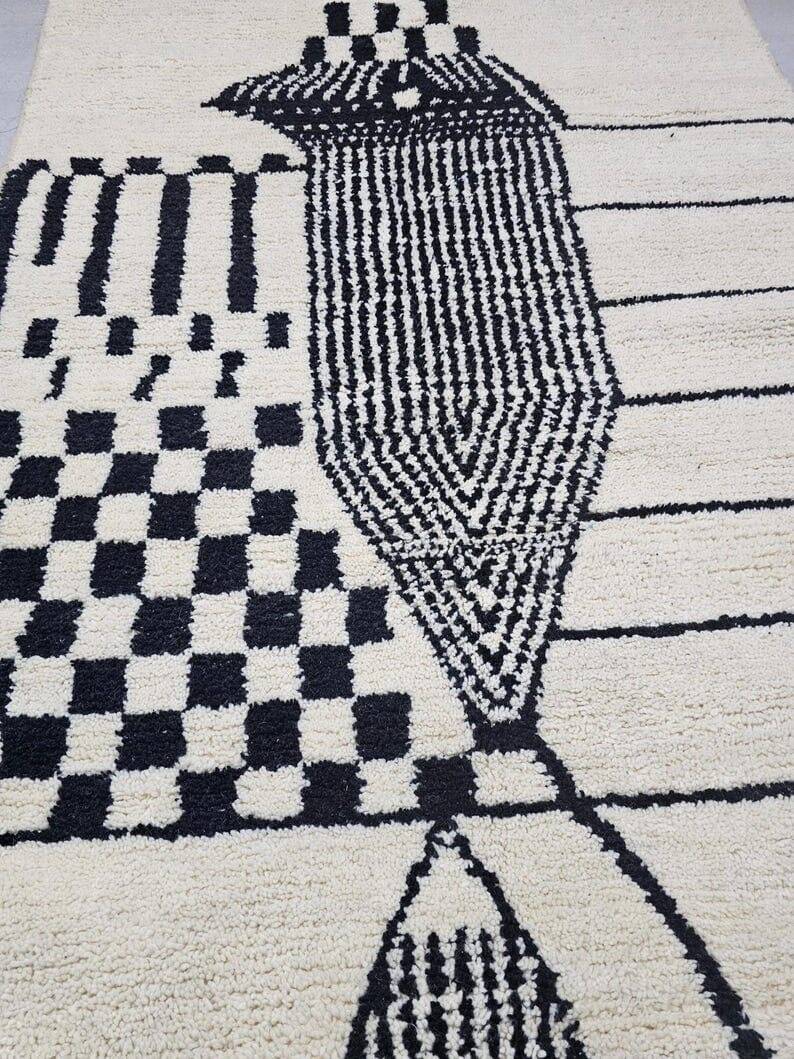 Handmade pure wool rug in black and white, size 150 x 250 cm.