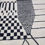 Handmade pure wool rug in black and white, size 150 x 250 cm.