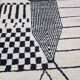 Handmade pure wool rug in black and white, size 150 x 250 cm.
