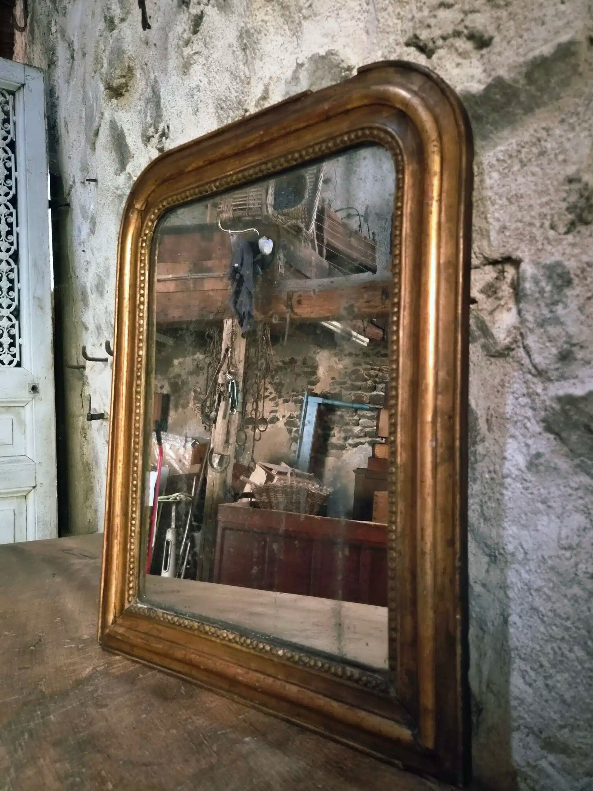 Antique French Louis Philippe mirror, gilded mercury mirror, 19th century.