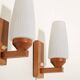 Pair of teak and opaline glass wall lamps, 1950s/1960s