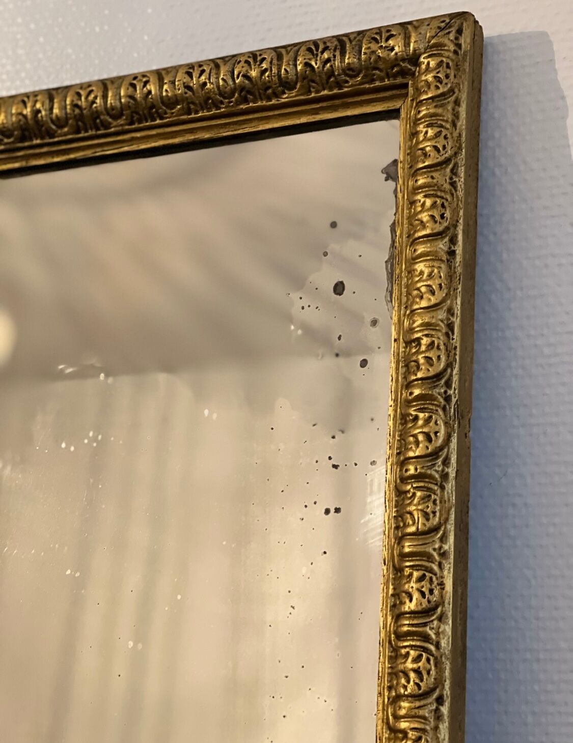 Old rectangular mirror between two golden Louis Philippe