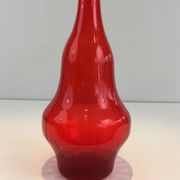 Large designer bottle in red glass