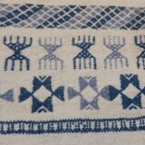 Handmade white and blue ethnic carpet