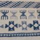 Handmade white and blue ethnic carpet