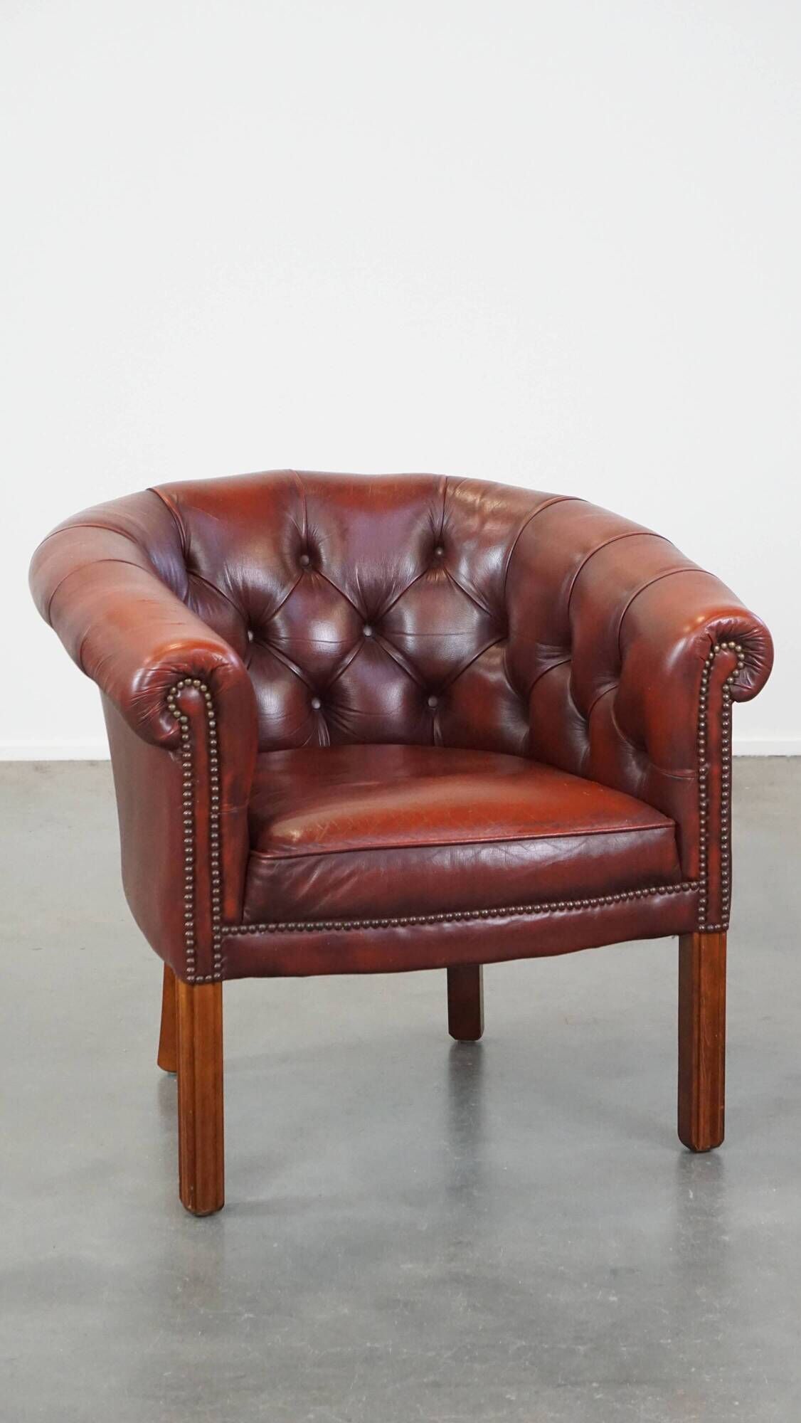 Red cow leather English chesterfield club chair