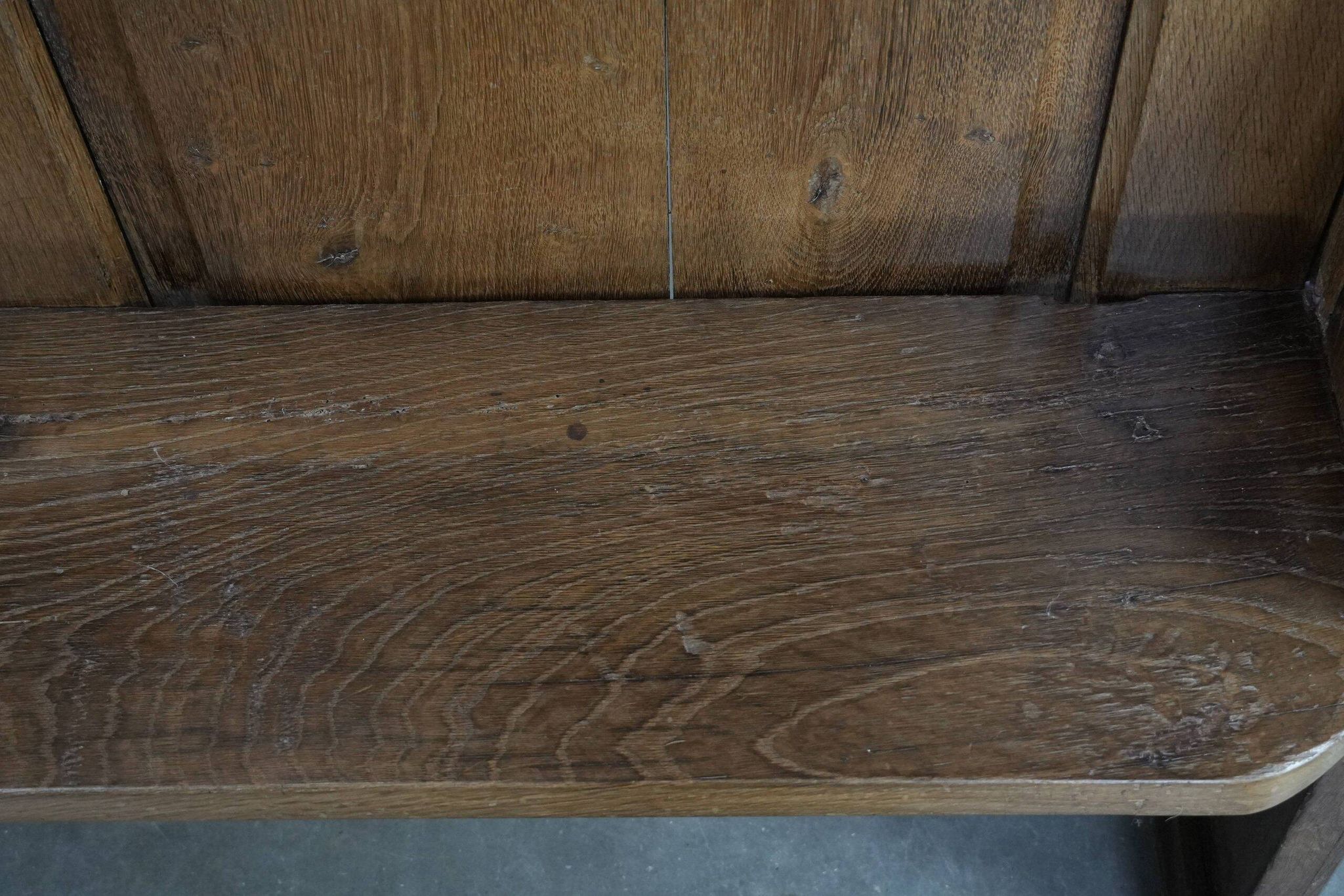 Antique oak church bench in Gothic style with beautiful wood carving