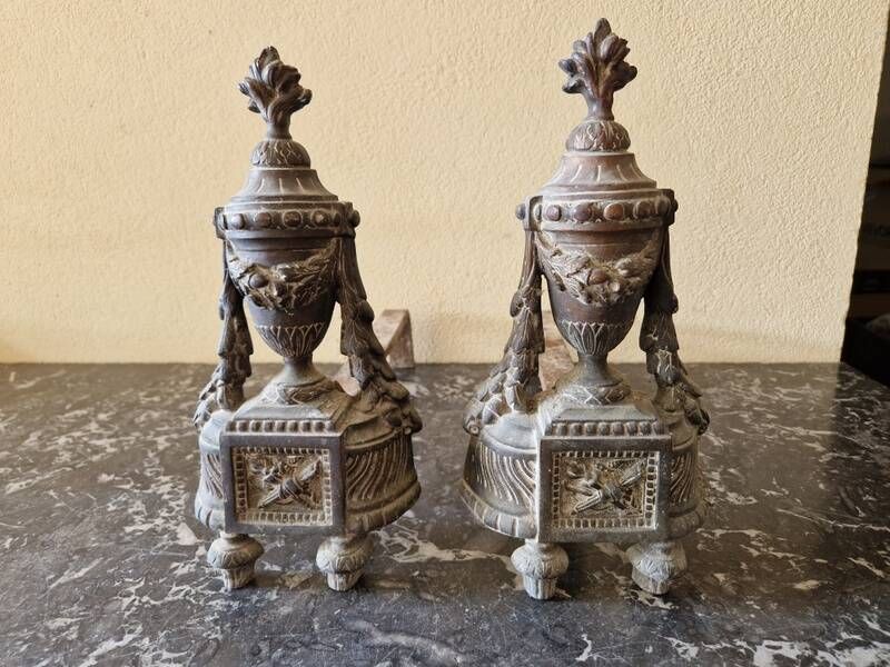 Pair of bronze andirons in Louis XVI style, late 19th century.