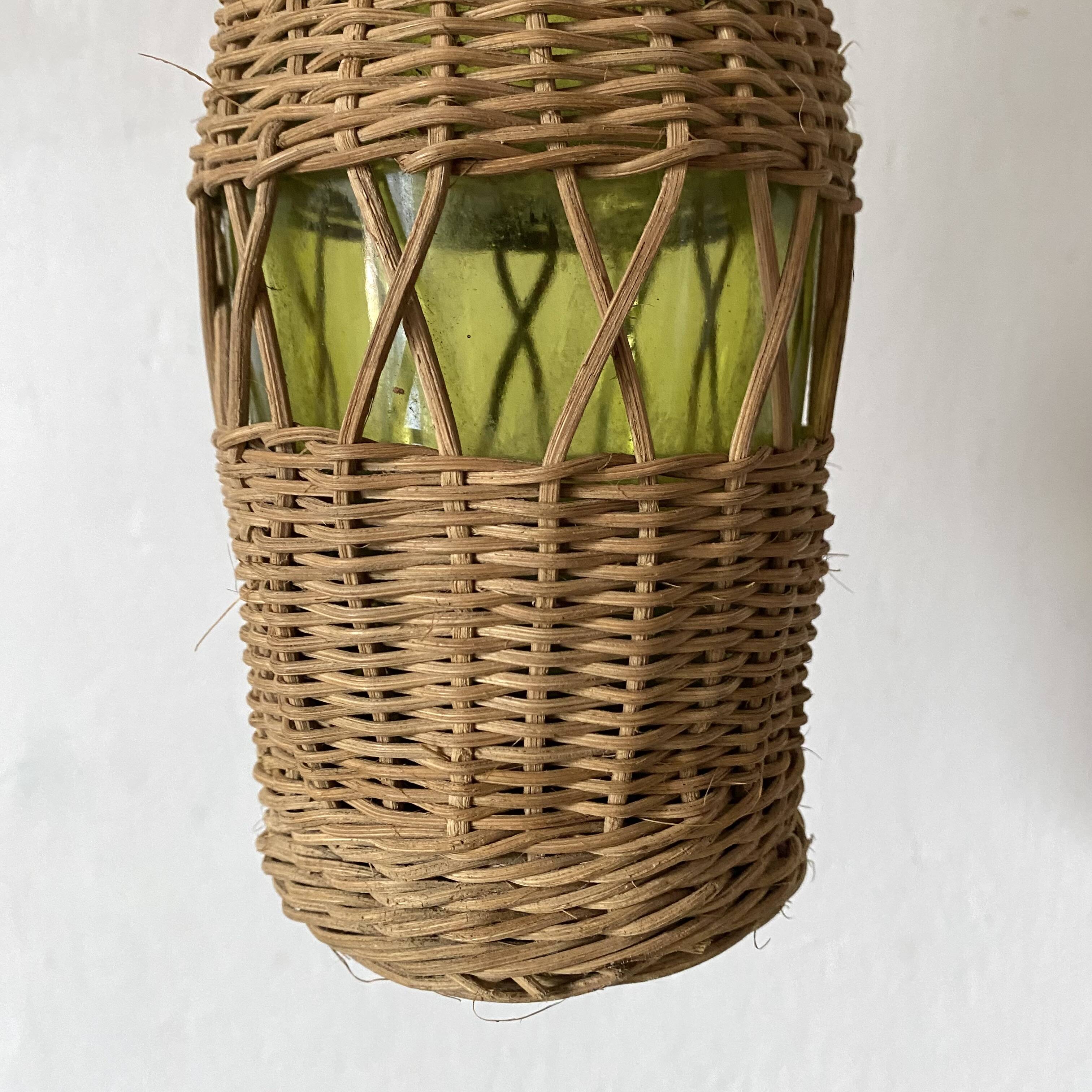 Glass bottles and woven rattan