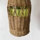 Glass bottles and woven rattan