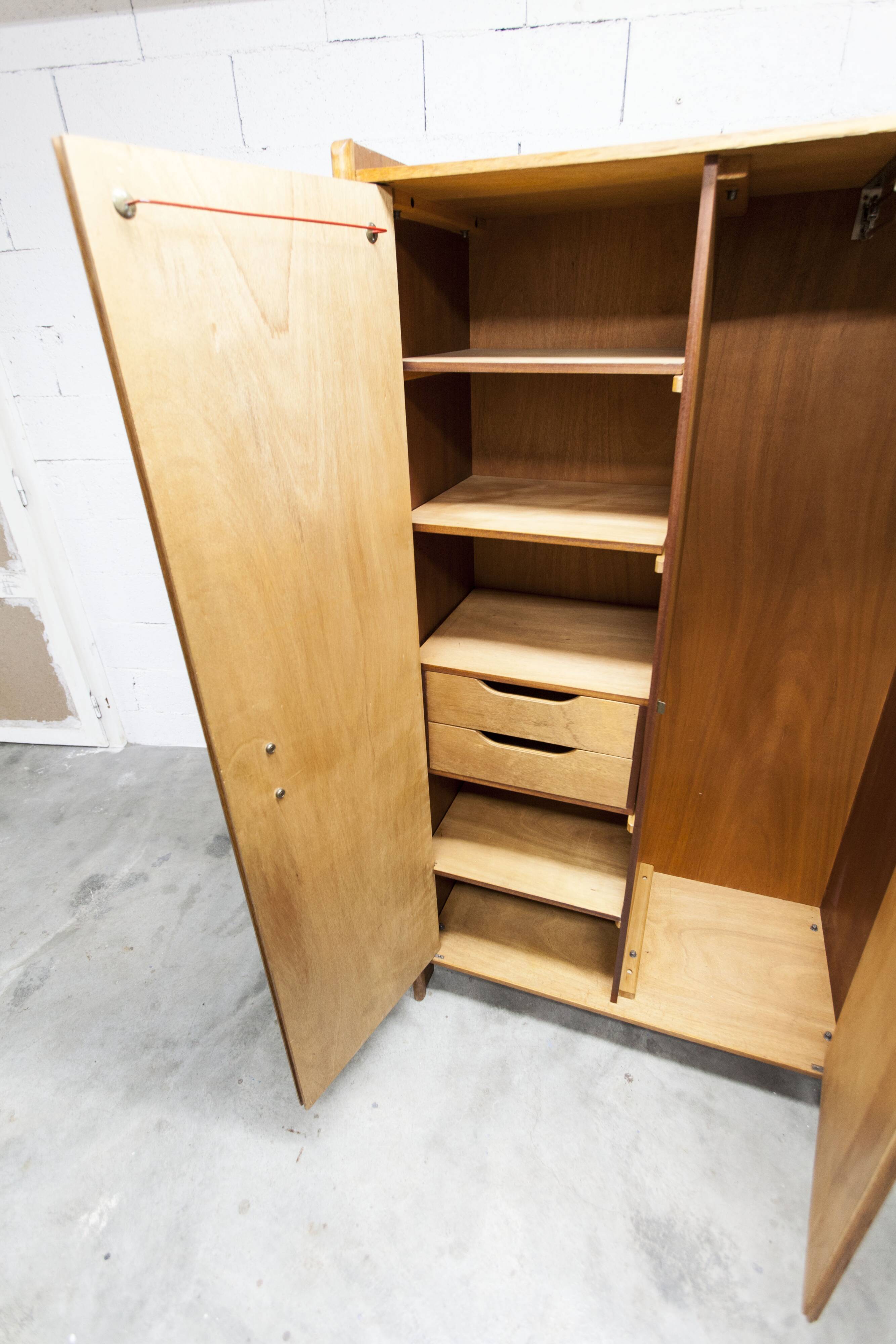 1950s Mid-Century Modern oak armoire with two doors and two drawers.