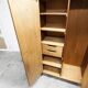 1950s Mid-Century Modern oak armoire with two doors and two drawers.