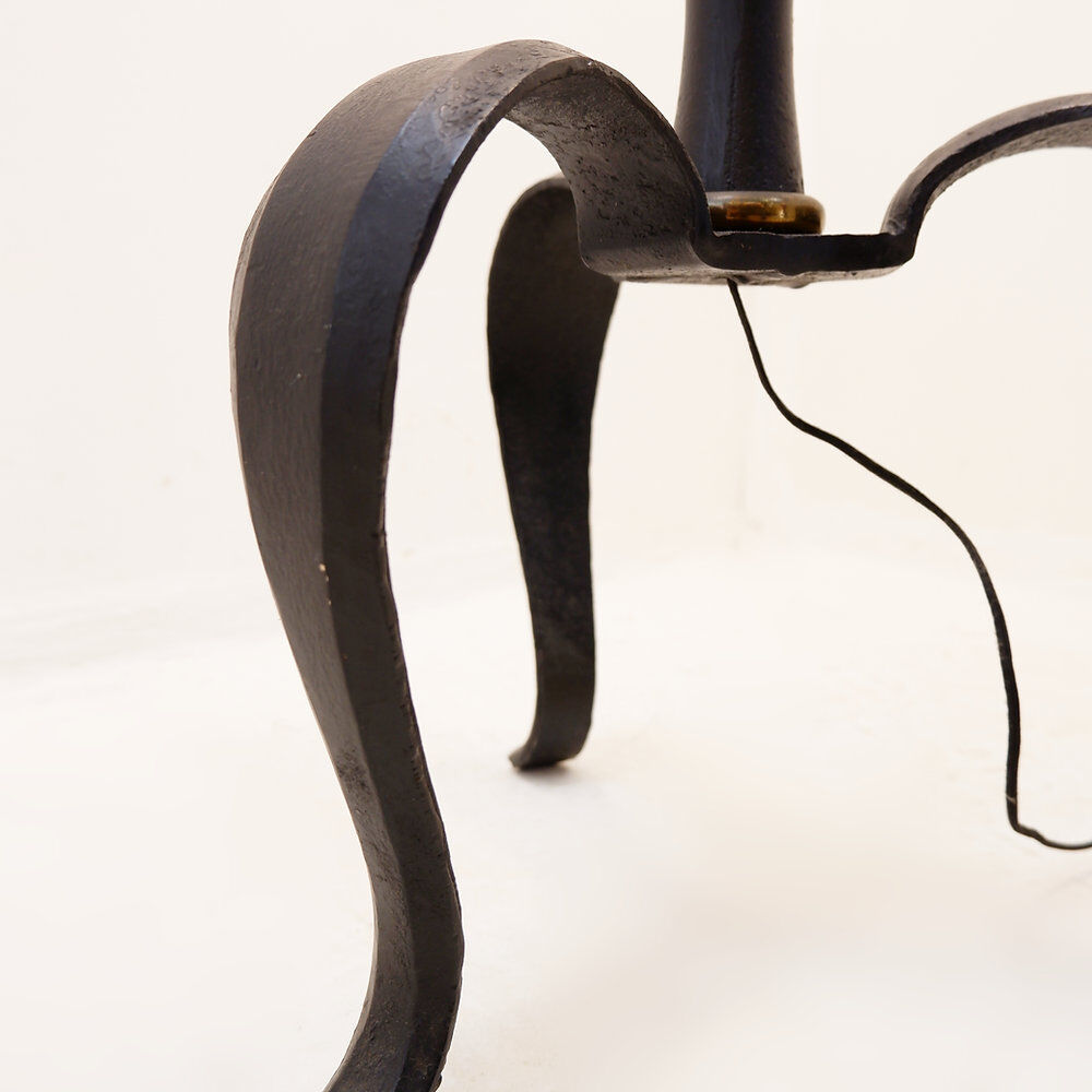 Tripod floor lamp in wrought iron and brass with bamboo-style base.