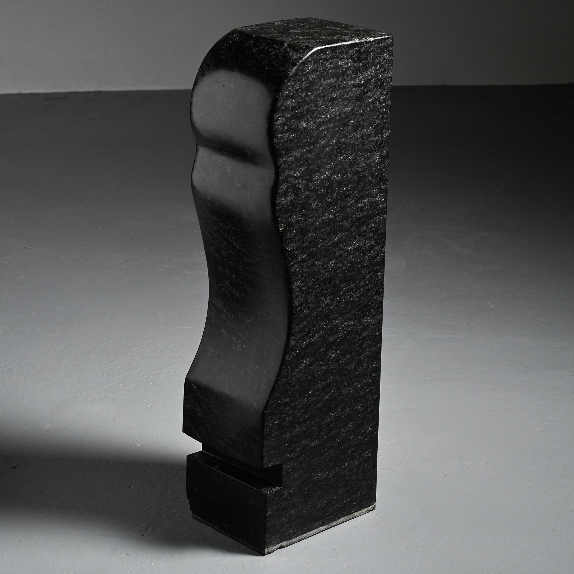 Abstract sculpture in diabase by Robert Neuhauser, Switzerland, circa 1985.