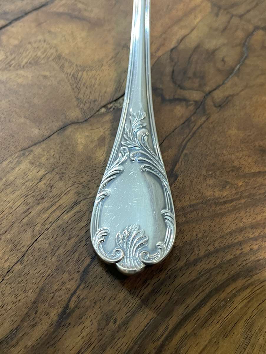 Series of 12 Christofle model Marly dessert spoons in silver metal