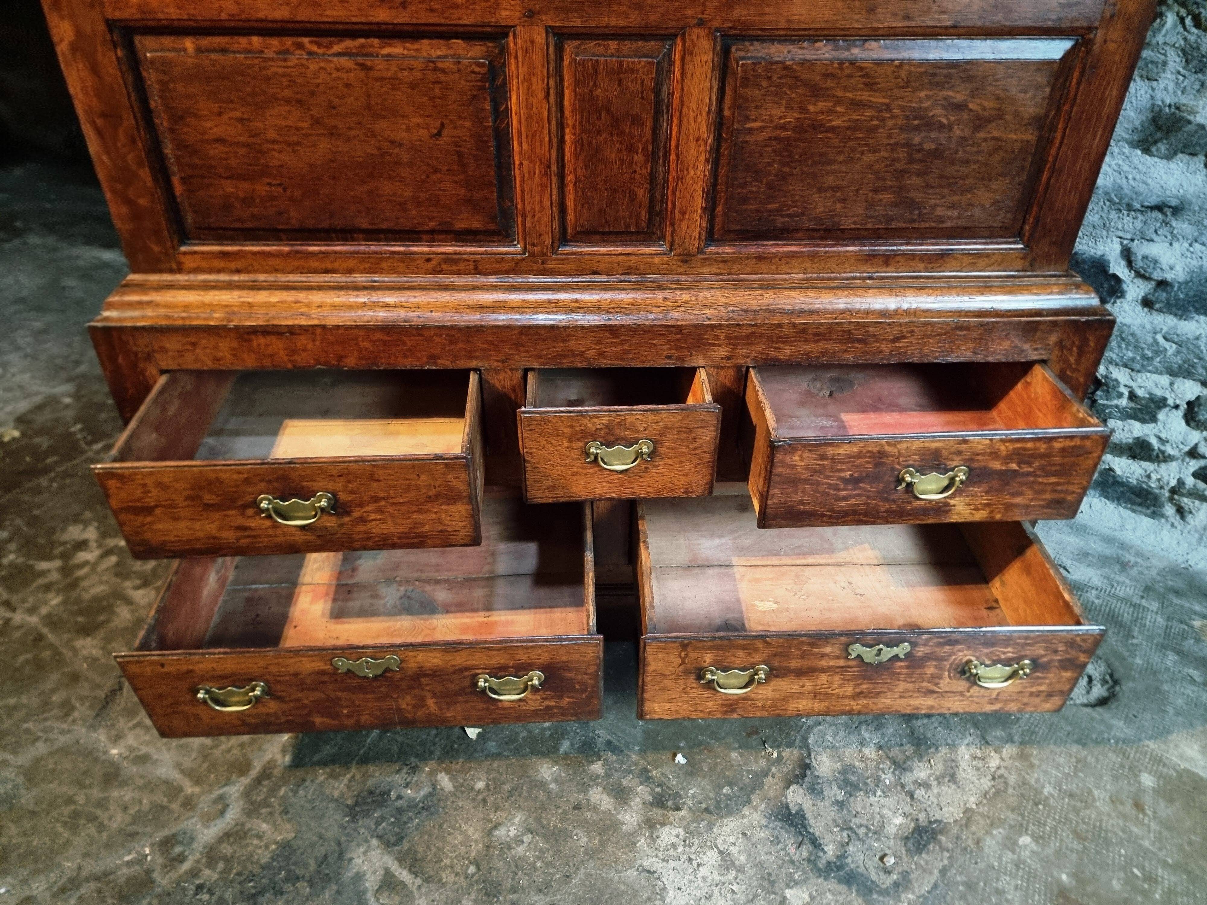 Antique English oak wardrobe with drawers, England, circa 1800–1820.