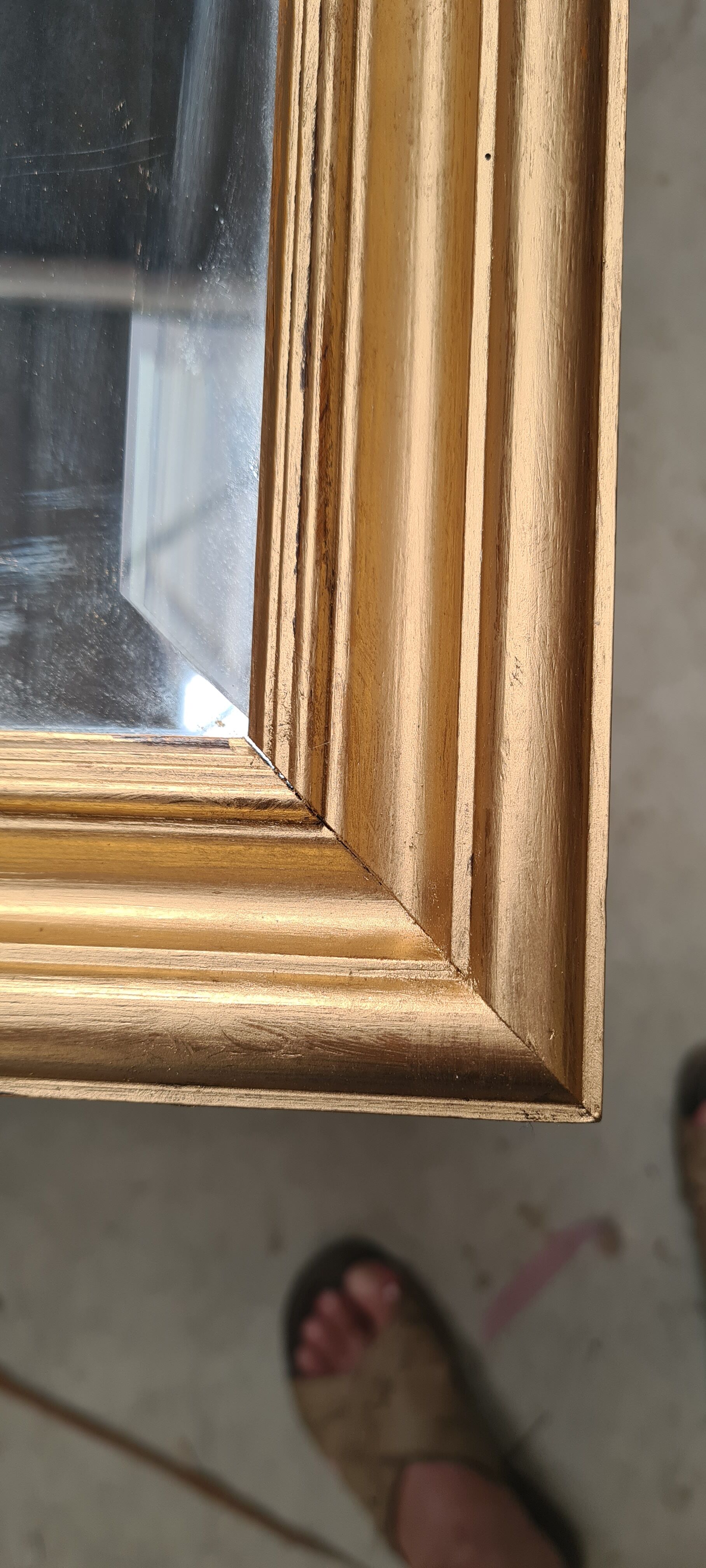 Gilded mirror on wood, 89x59