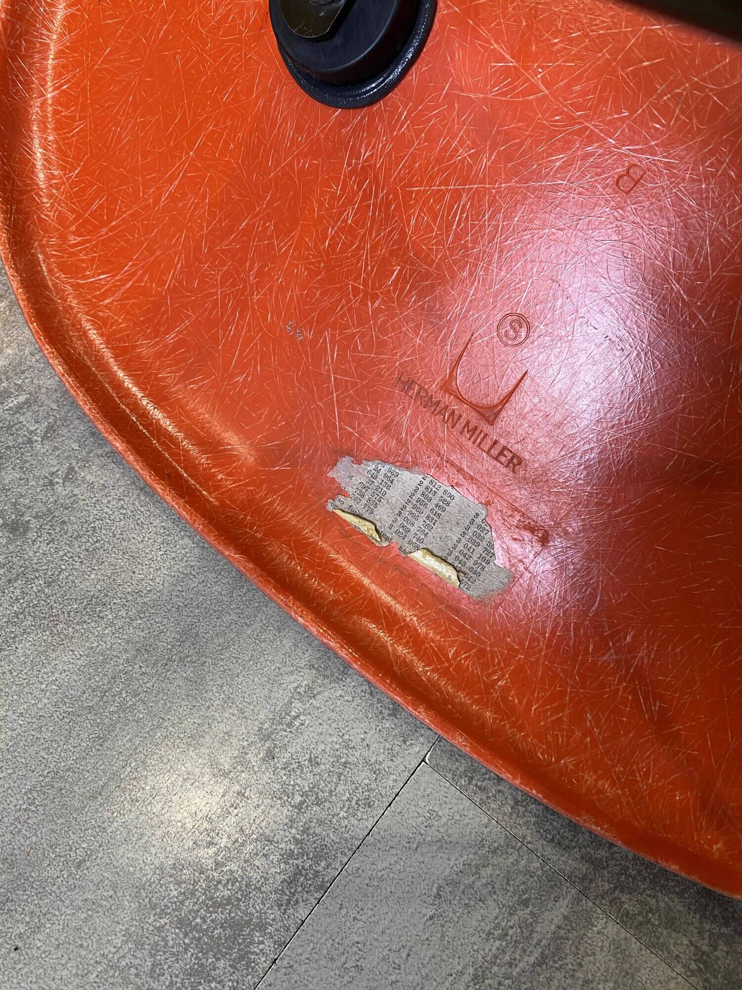 A vintage 70s Eames Herman Miller DSW Fiber Red Orange Dowel Walnut Chair