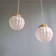 Pair of Art Deco pendant lights in pressed molded satin glass, 1920-30
