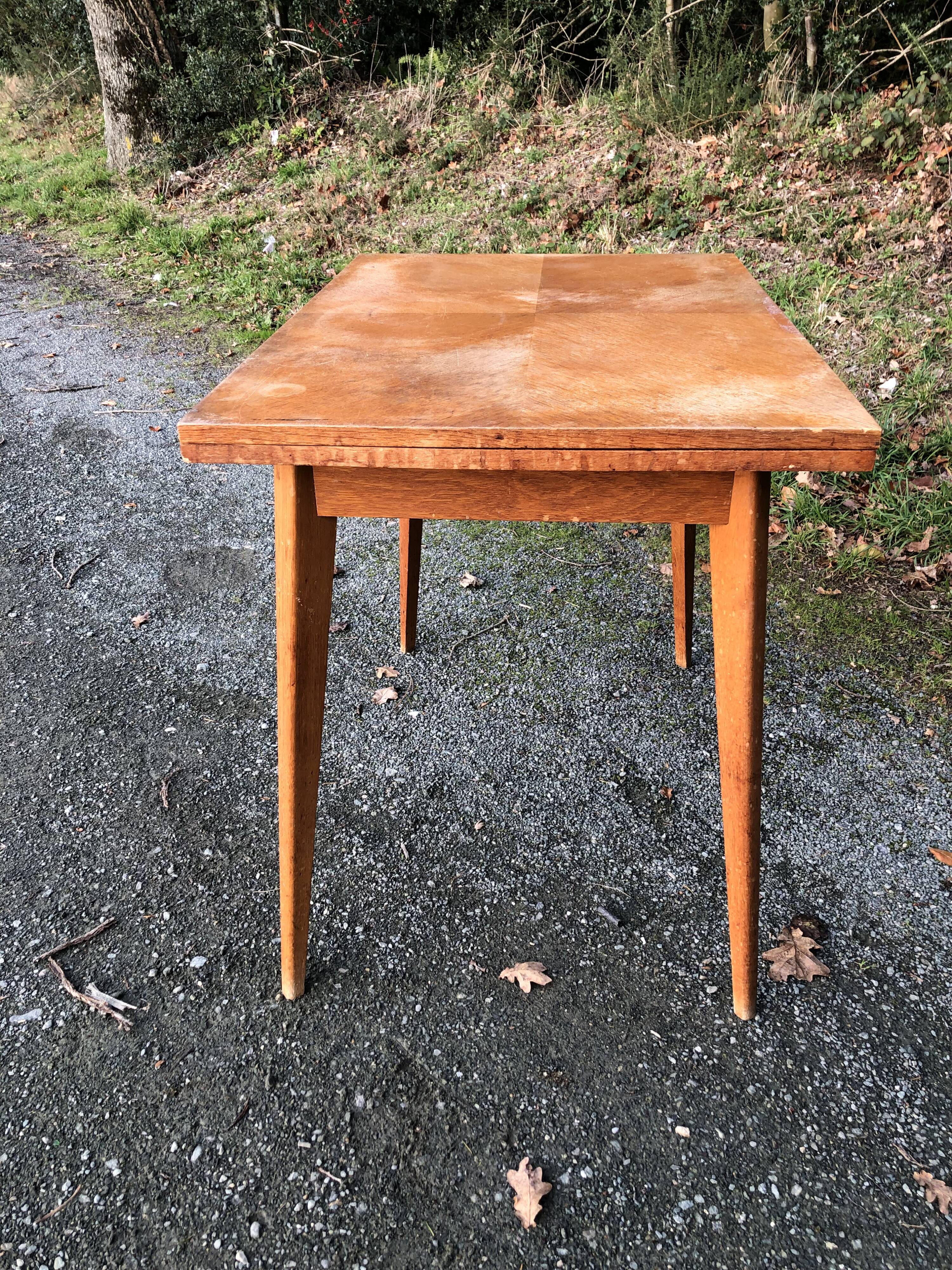 Vintage so-called portfolio table with oak compass base and its oak cp swivel top.
