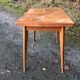 Vintage so-called portfolio table with oak compass base and its oak cp swivel top.