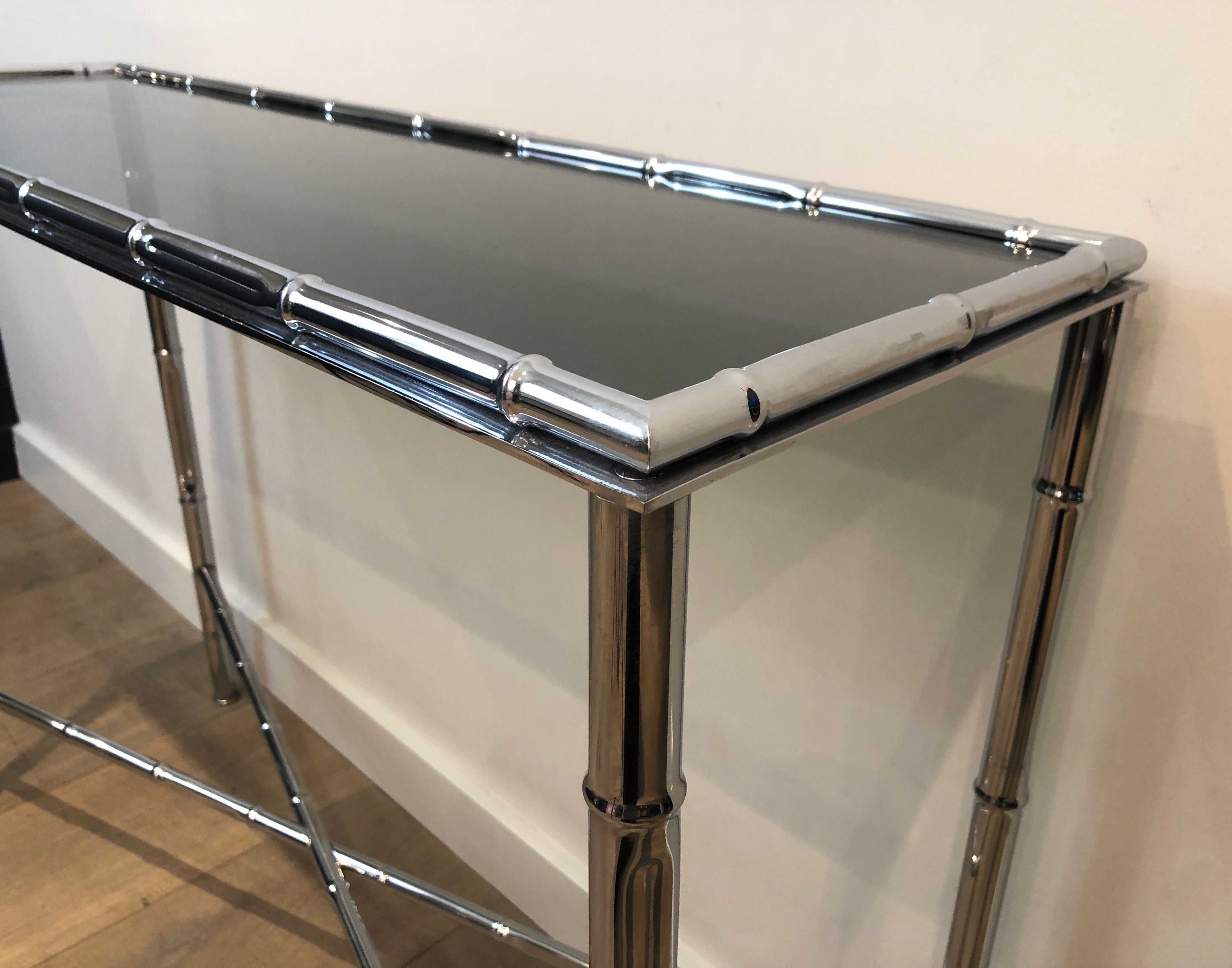 Console and chrome faux-bamboo mirror