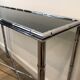 Console and chrome faux-bamboo mirror