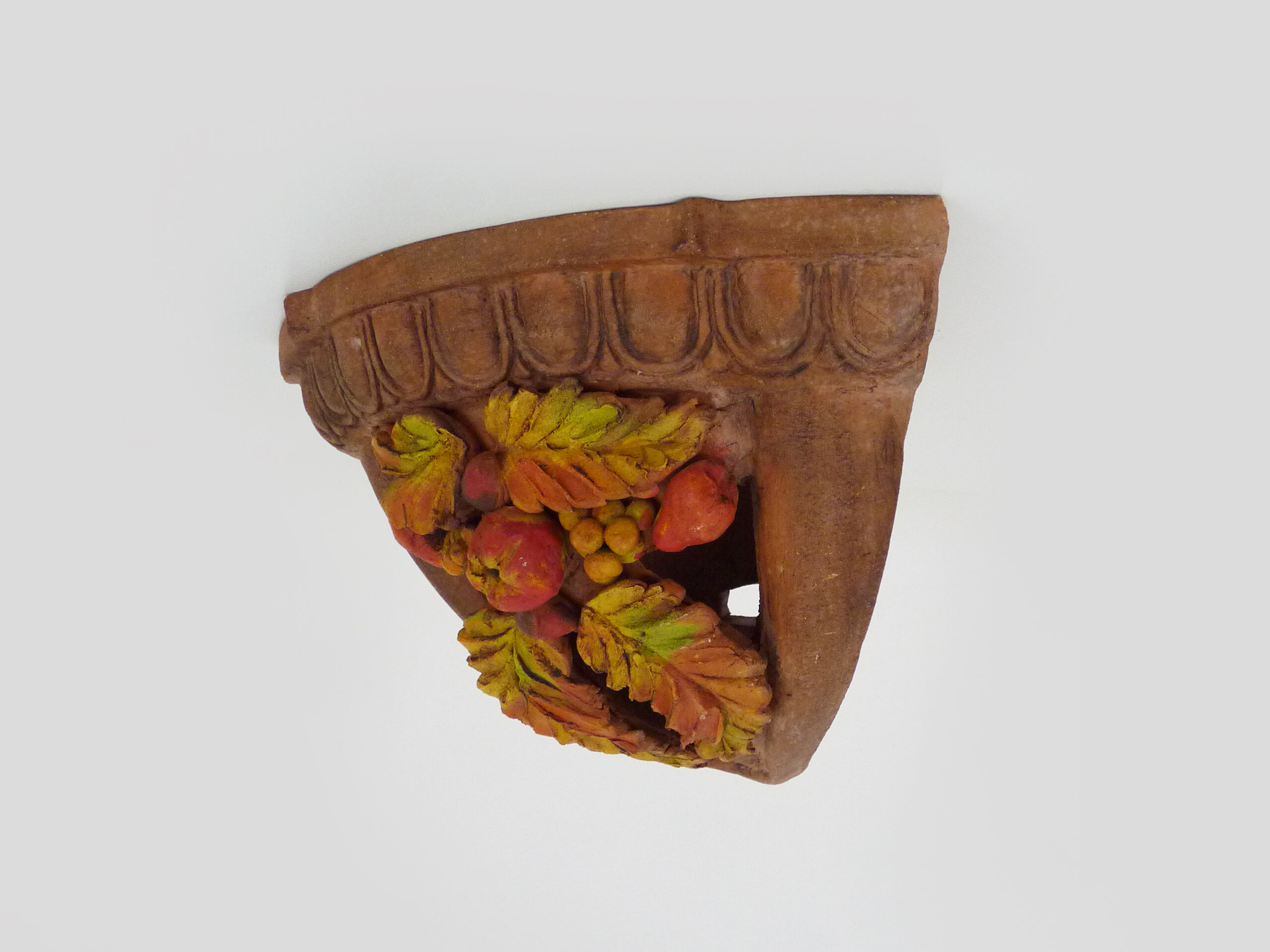 Corner wall lamp in terracotta with fruit decoration, signed D.Chadeau