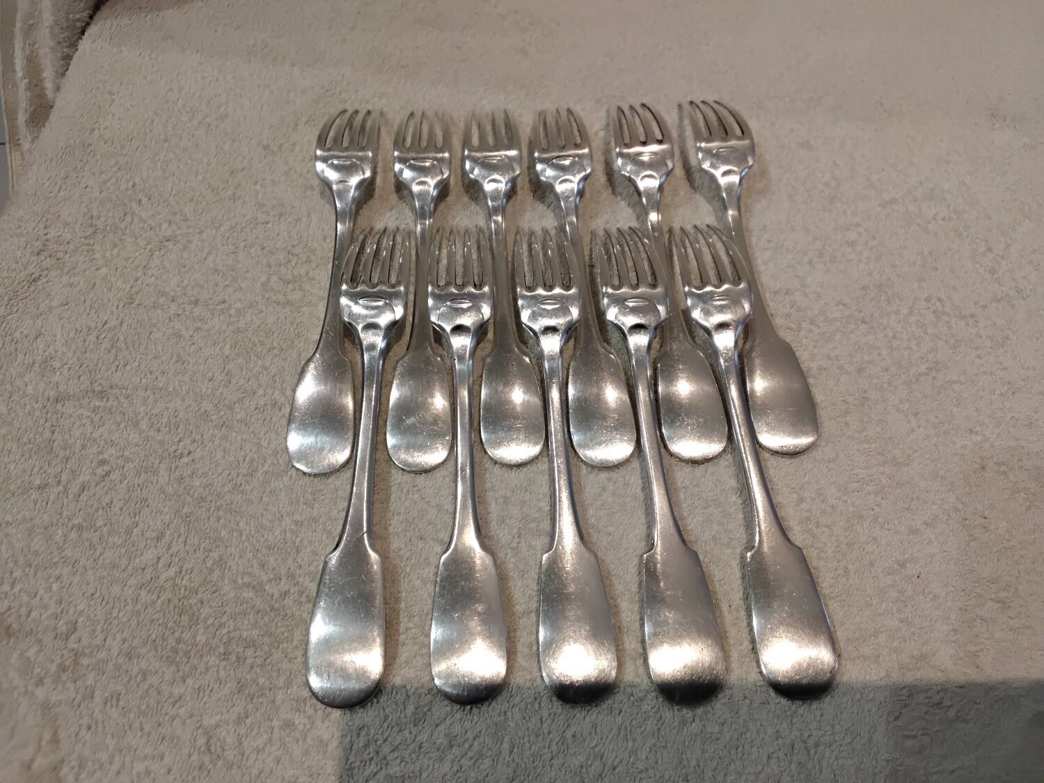 11 silver-plated table forks by Christofle Cluny with stripes