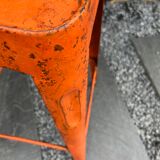Orange metal workshop stool