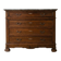 Antique wooden chest of drawers with a marble top.