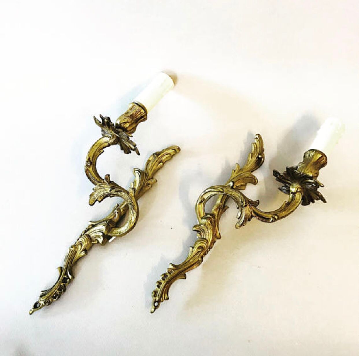 A pair of rococo gilded wall lights