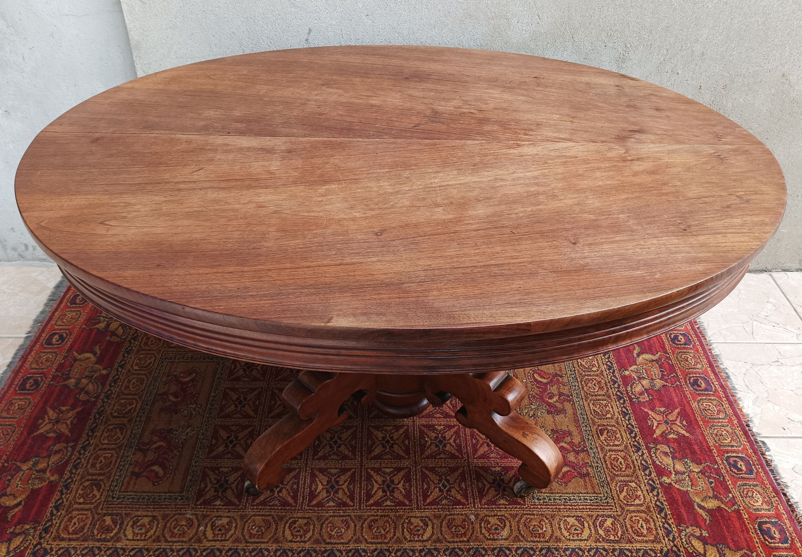 English oval table with 19th century mahogany extensions