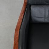 Art Deco design armchair with black leather with decorative stitching