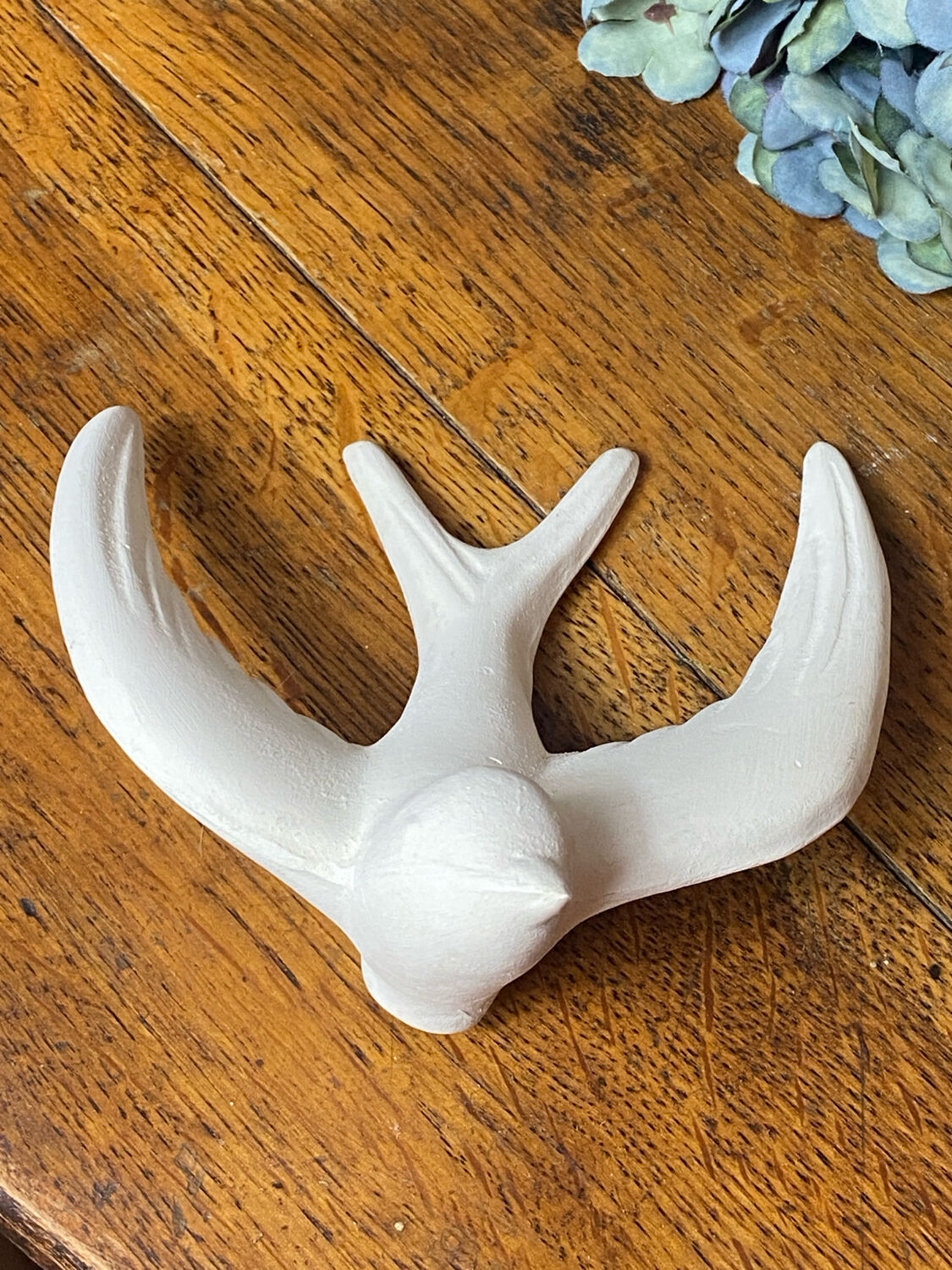 Pair of plaster swallows