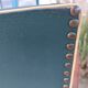 pair of dark green bridge armchairs