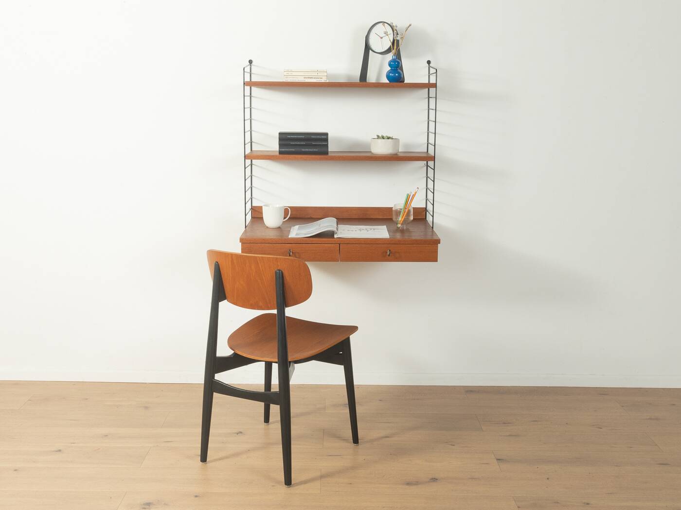 Original String shelf by Nils Strinning in teak veneer, 1949