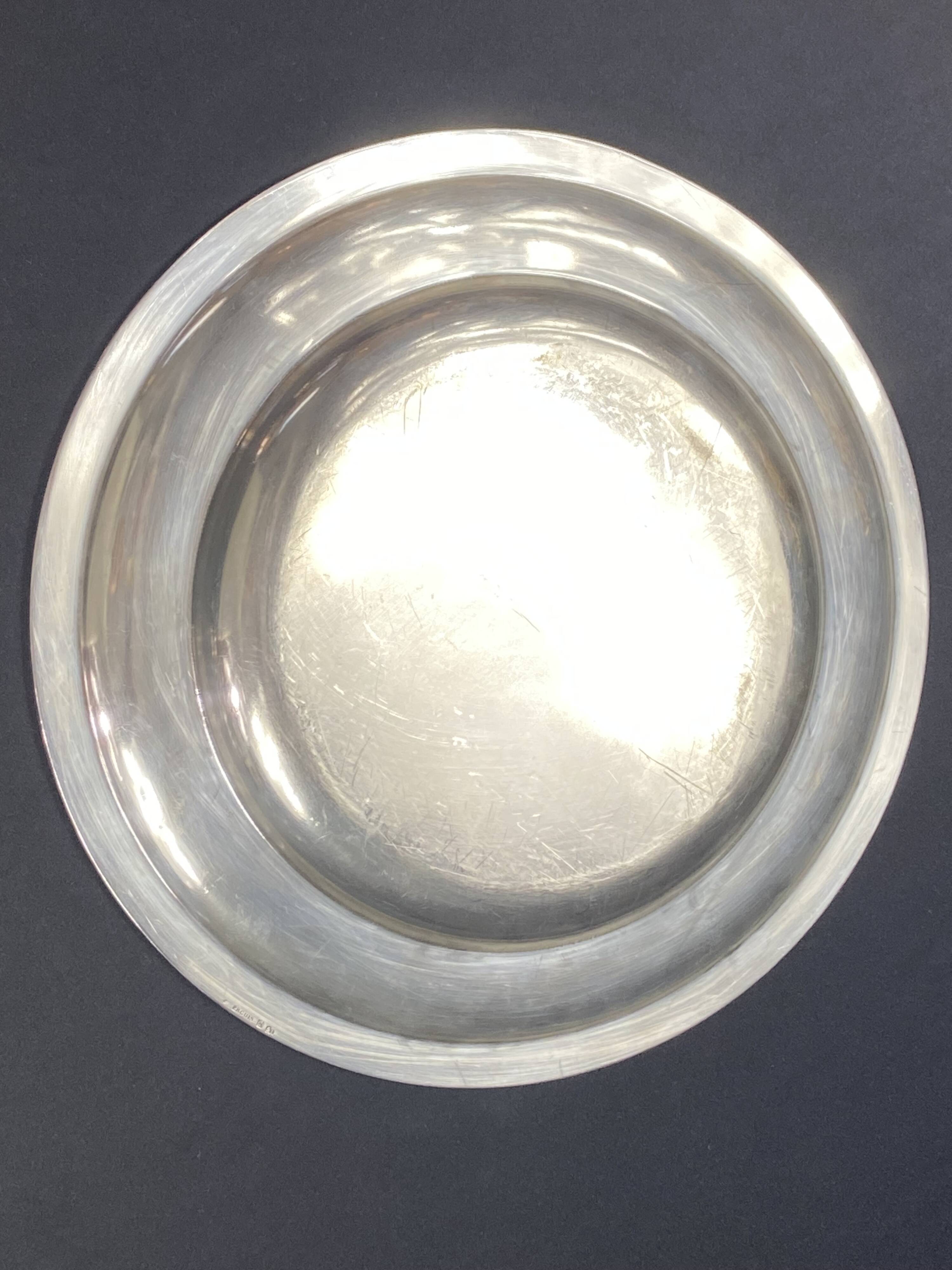 Circular silver-plated metal dish signed ercuis