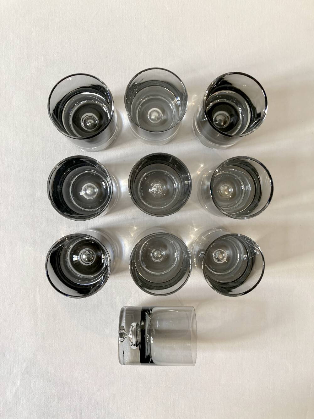 10 smoked glass aperitif glasses, 1960s-1970s