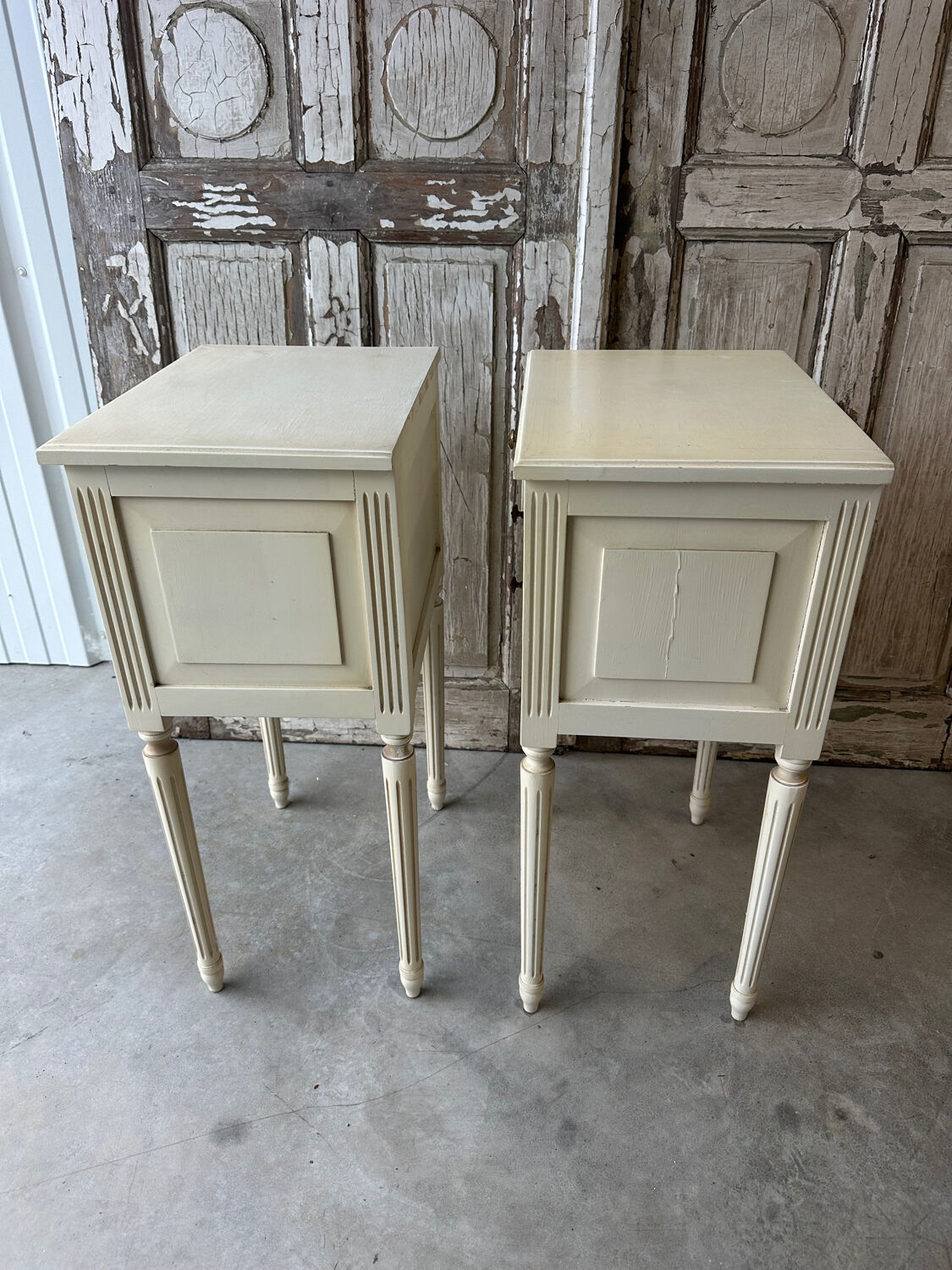 Pair of Louis XVI style bedside tables in white lacquered wood