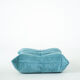 Ensemble de fauteuil et pouf Togo en velours côtelé bleu clair.