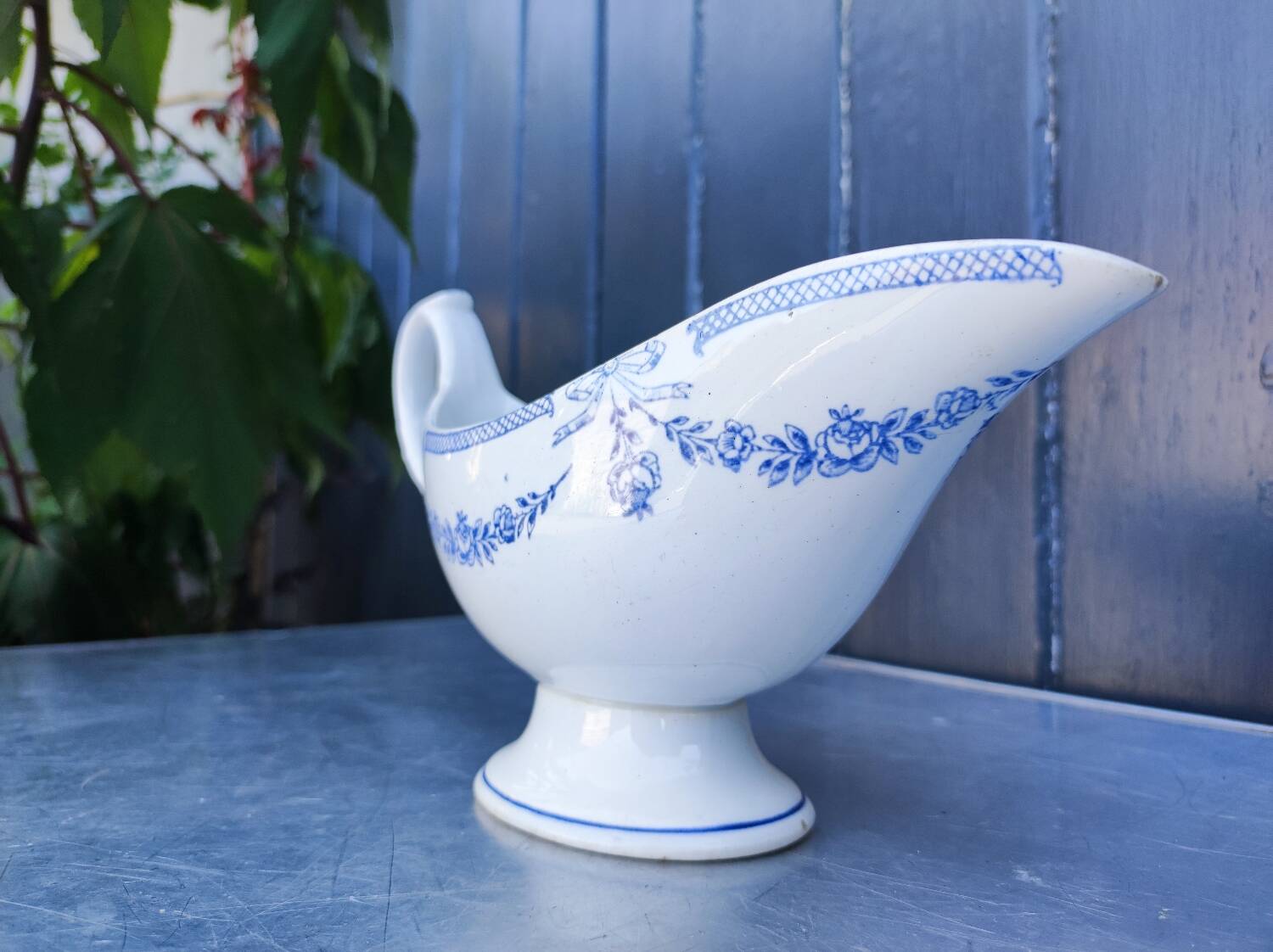 Old earthenware sauce boat