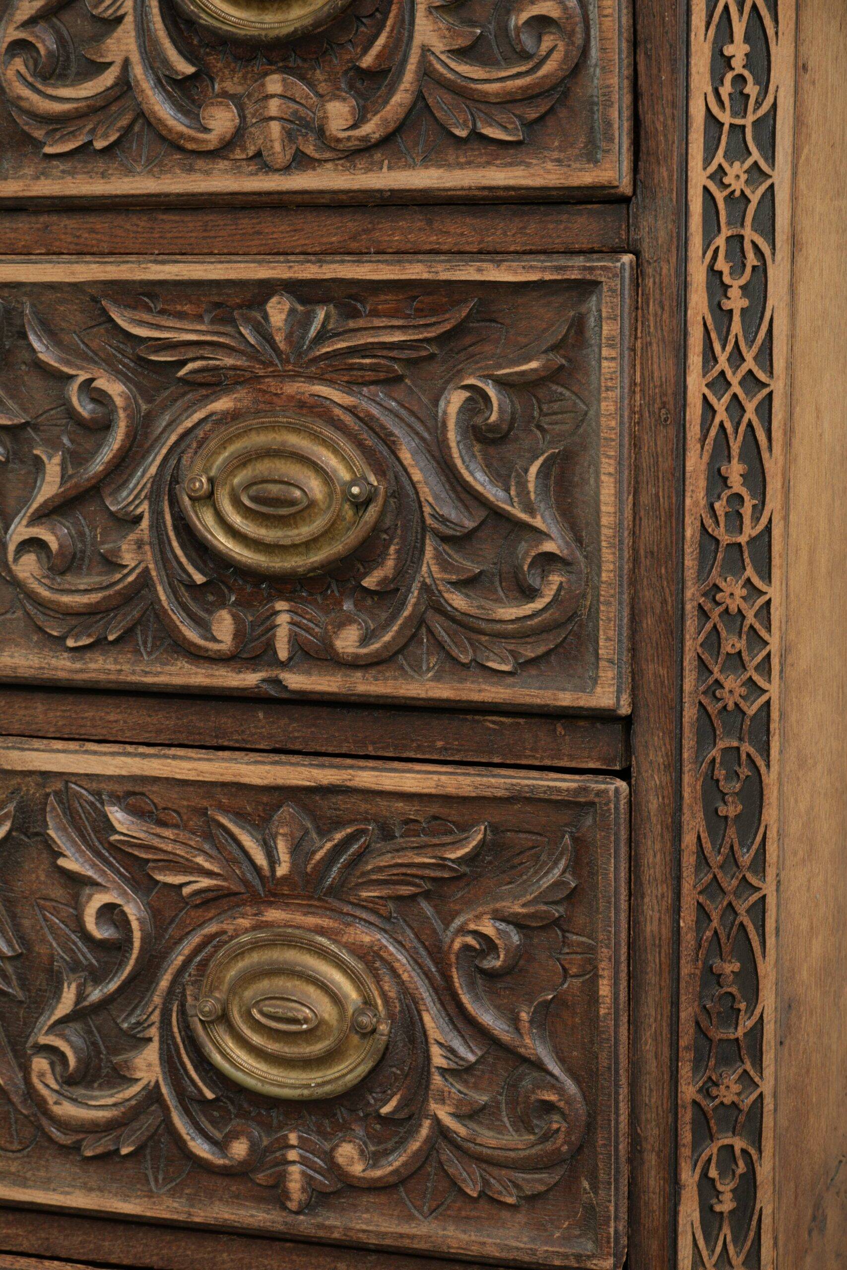 Richly carved English oak chest of drawers from the 18th century