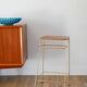 Small brass side table with a teak top, 1960.
