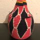 Berber wool and red and black raffia basket