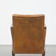Cognac-colored sheepskin and wooden Art Deco design armchair