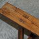 Pair of antique Victorian trestle benches in fruitwood.